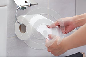 Close-up of in Hand using a toilet paper