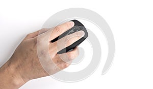 Close-up of hand using wireless computer mouse to find the necessary information
