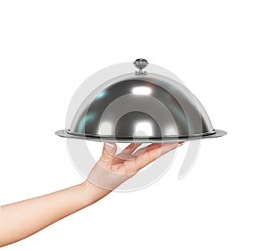 Close up hand of waiter with metal cloche lid cover and tray photo