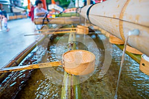 Close up of hand wash pavilion in Fushimi Inari Shrine in Kyoto