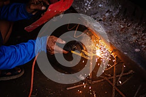 close up hand of welder, craftsman, Industrial Worker welding erecting technical steel Industrial