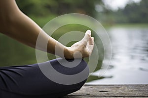 Close up hand. Woman do yoda outdoor. Woman exercising yoga