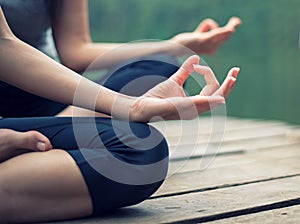Close up hand. Woman do yoga outdoor