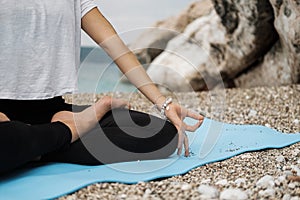Close up Hand of Woman Doing an Outdoor Lotus Yoga Position and