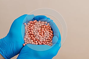 Close-up of a handful in the hands in the form of a heart etched soybean seeds