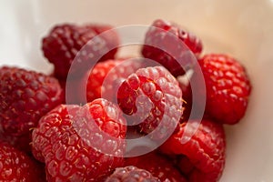 close-up of a handful of raspberries