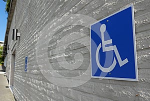 Close up of handicapped parking sign on wall