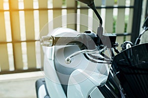 Close up of handlebars and front break on motorcycle