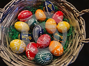 Close up of handmade colorful eastereggs in a green nest