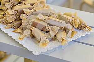 Close up of handmade toffees wrapped in craft paper