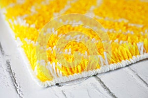 Close up handmade yellow and white wool mat
