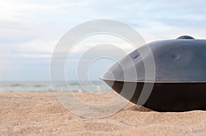 Close up of handpan or hang with sea and beach on Background. The Hang is traditional ethnic drum musical instrument