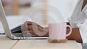 Close up hands of african american girl in home office working typing on laptop spbi. student female