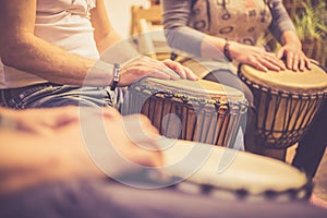 Close up of hands on african drums, drumming for a music therapy, therapy by drums