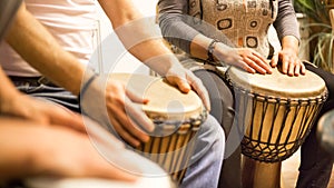 Close up of hands on african drums, drumming for a music therapy, therapy by drums