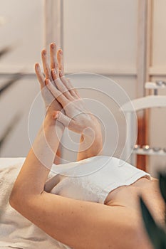Close-up of Hands Applying Lotion in a Spa Setting photo