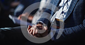 Close Up on Hands of an Audience of People Applauding in Concert Hall During a Business Conference