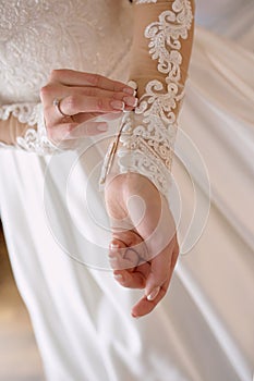 Close up hands of beautiful attractive woman bride