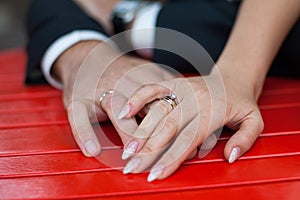 Close-up of the hands of the bride and groom