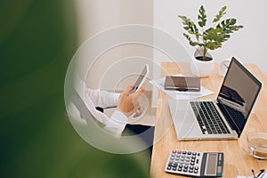 Close up of hands of business man working on laptop.Blank screen