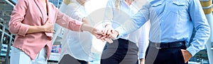Close up on hands of business people join together on unity concept