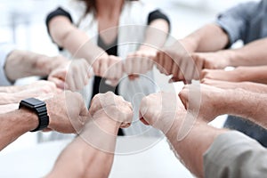 Close up.hands of the business team forming a circle