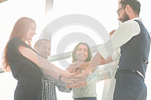 Close-Up of hands business team showing unity with putting their hands togethe