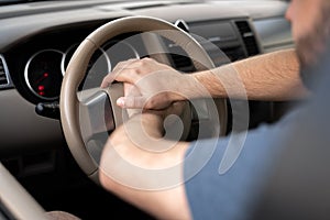 Close up hands of Car Driver Honking in a traffic jam.