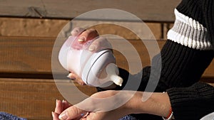 Close up of hands checking tempreture of baby formula