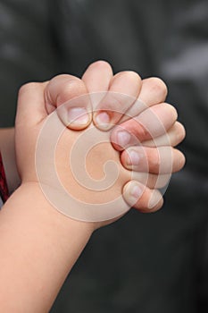 Close-up of hands clasped in prayer