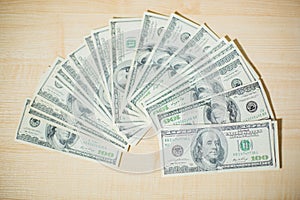 Close-up of hands counting money. Happy child with money dollar, little businessman. Pile of United States dollar hundred USD