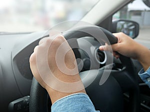 Close up of Hands Driving Car Concept