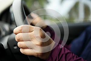 Close up of Hands Driving Car Concept