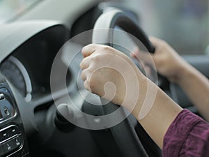 Close up of Hands Driving Car Concept