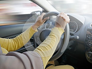 Close up of Hands Driving Car Concept