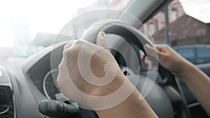 Close up of Hands Driving Car Concept