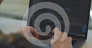 Close up hands engineers developing software app using digital laptop computer typing code on screen programmers coding