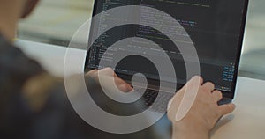 Close up hands engineers developing software app using digital laptop computer typing code on screen programmers coding