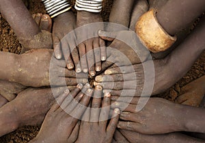 Close-up of hands of a group of tribal children, Ethiopia
