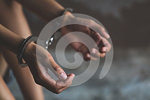 Close-up of hands in handcuff, Female prisoner, Arrested woman