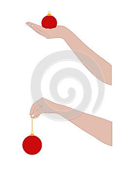 Close up hands holding Christmas ball ornaments