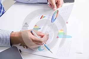 Close up hands holding pen and document