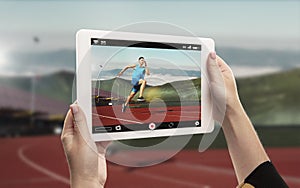 Close up hands holding tablet viewing sport, online translation, streaming of championship