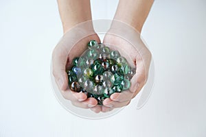 Close up hands holds marbles balls