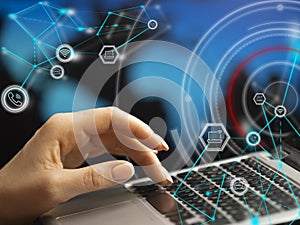 Close-up hands with laptop keyboard. Double exposure - icons, connections and schematic representation of the global