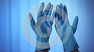 Close-up hands in latex rubber gloves, medical sterility, skin protection photo