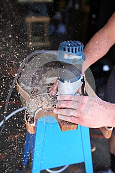 Close Up on Hands of Luthier Building a Wood Handmade Guitar photo