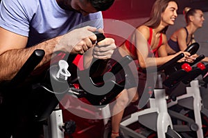 Close up hands of man biking in spinning class