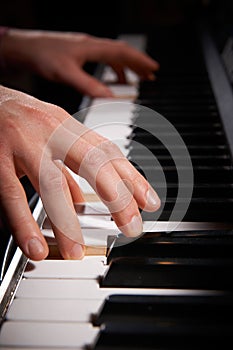 Close Up Of Hands Playing Electric Piano Keyboard