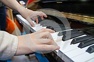 Close up of the hands playing the piano, art, musical performance